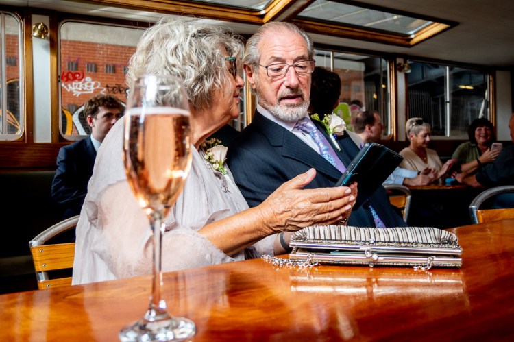Wedding guests chat during a wedding on the Flower of Bristol boat, run by Bristol Packet,  in Bristol.