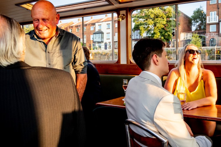 Guests enjoying themselves during a Bristol wedding on the Flower of Bristol boat, run by Bristol Packet tour company.