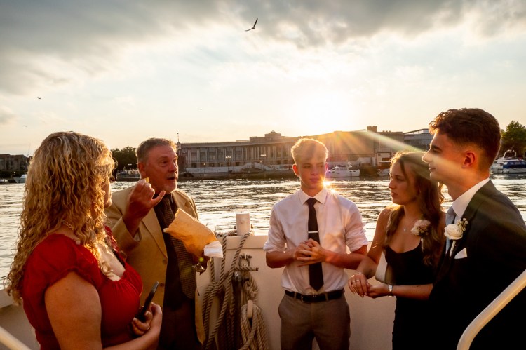 Guests with views of the River Avon, during a Bristol wedding on the Flower of Bristol boat, run by Bristol Packet tour company.