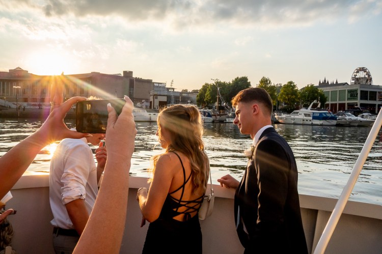 Guests enjoying views of Bristol from the River Avon, during a Bristol wedding on the Flower of Bristol boat, run by Bristol Packet tour company.