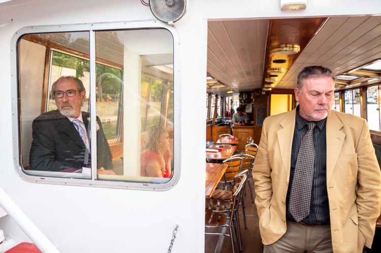 Guests hanging around during a Bristol wedding on the Flower of Bristol boat, run by Bristol Packet tour company.