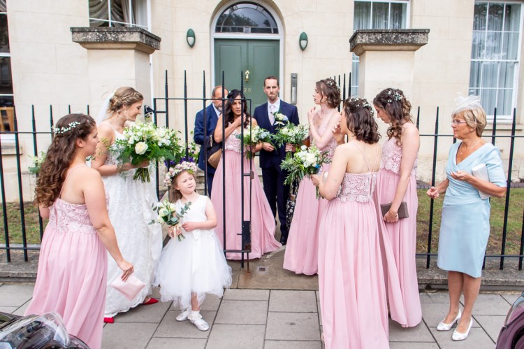 The bridal party gather ahead of travelling to a wedding at Worcester College in Oxford.