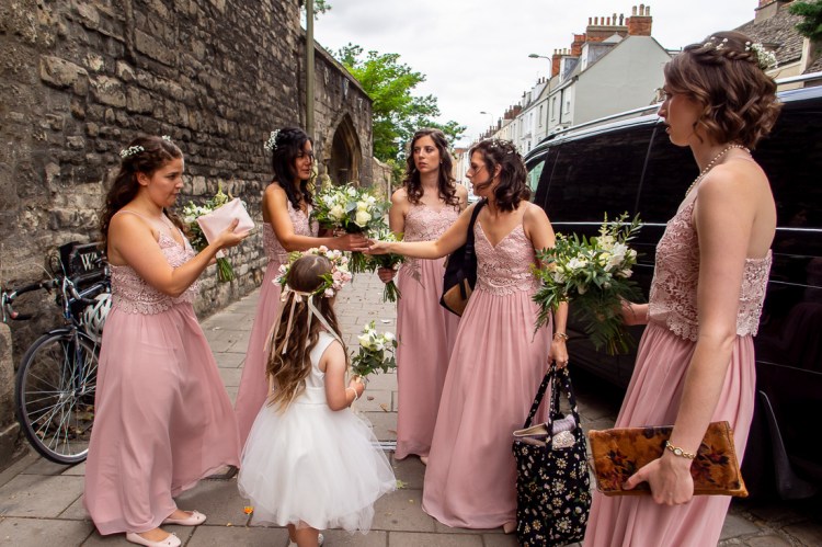The bridal party arrive at a wedding at Worcester College in Oxford.