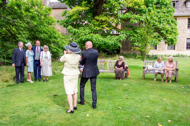 Guests taking photos during a wedding at Worcester College in Oxford.