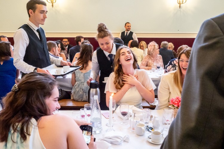 A guest laughs during a wedding at Worcester College in Oxford.