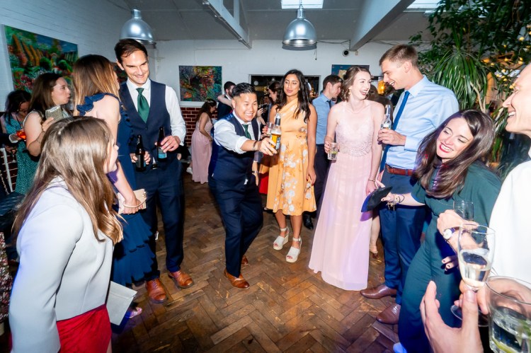 A groomsman on the dancefloor, during the evening wedding reception at the Jam Factory in Oxford.