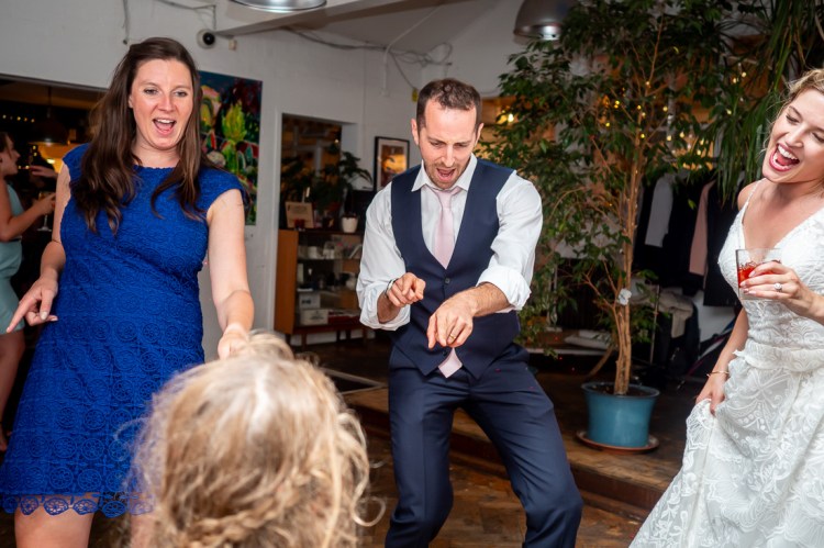 A male guest dancing during the evening wedding reception at the Jam Factory in Oxford.