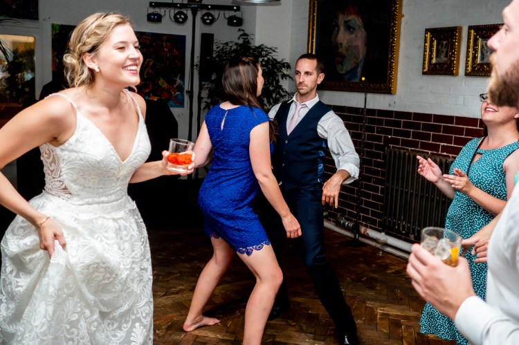 The bride and guests dancing during the evening wedding reception at the Jam Factory in Oxford.