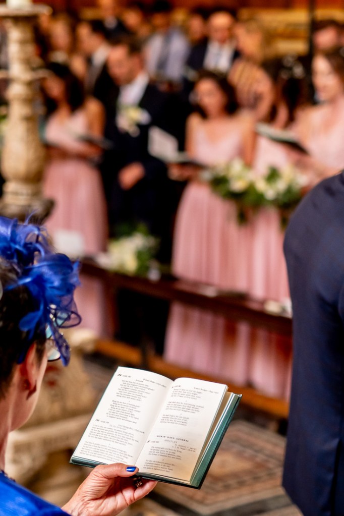 Guests sing hymns during a wedding at Worcester College in Oxford.