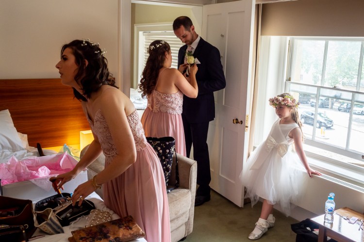 The flower girl watches the bridal preparations ahead of a wedding at Worcester College in Oxford.