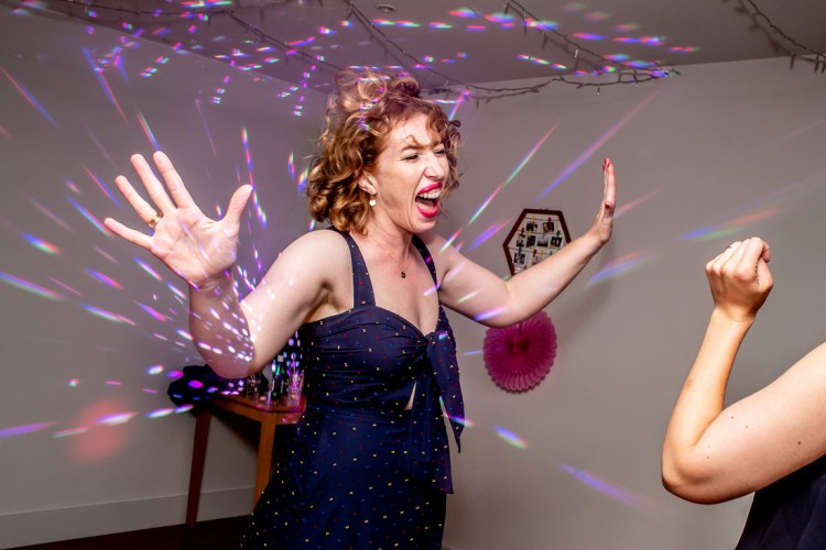 A guest on the dancefloor, during a wedding at Highdown Vineyard in West Sussex.