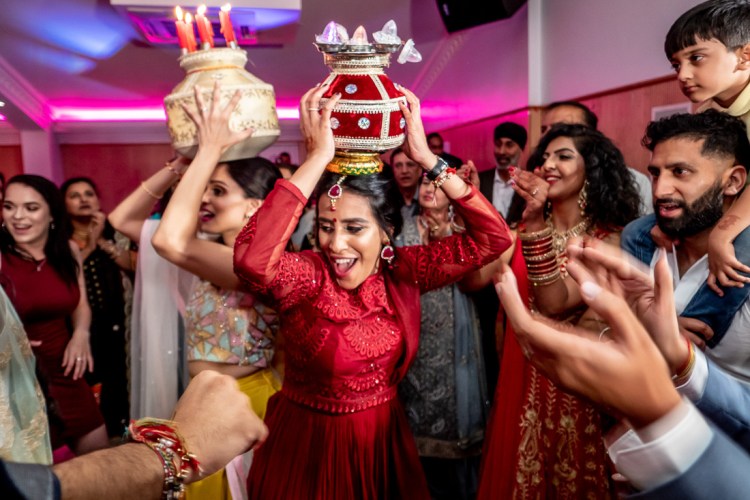 Guests celebrate during a Sikh Jaago wedding in Mitcham, London.