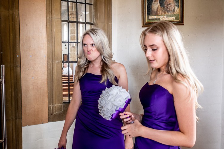 A bridesmaid pulls a funny face ahead of a wedding ceremony in Abington, Northampton.