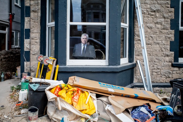 Candid street photography of Prince Andrew cardboard cut out in a window in Weston-super-Mare.